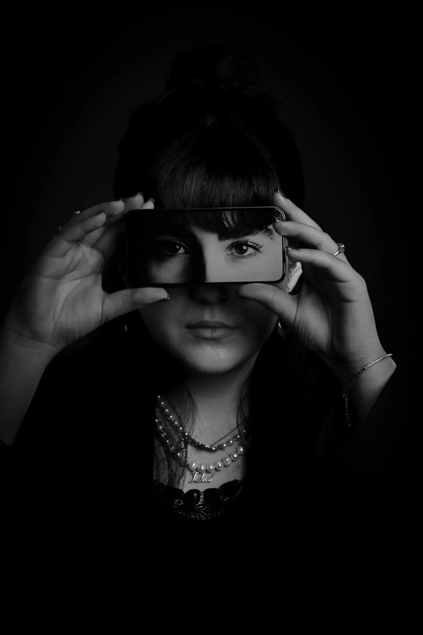 Dudette with phone infront of their eyes